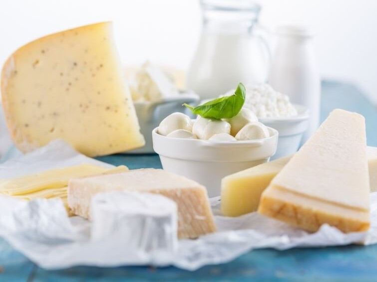 different types of cheese laid out on a table