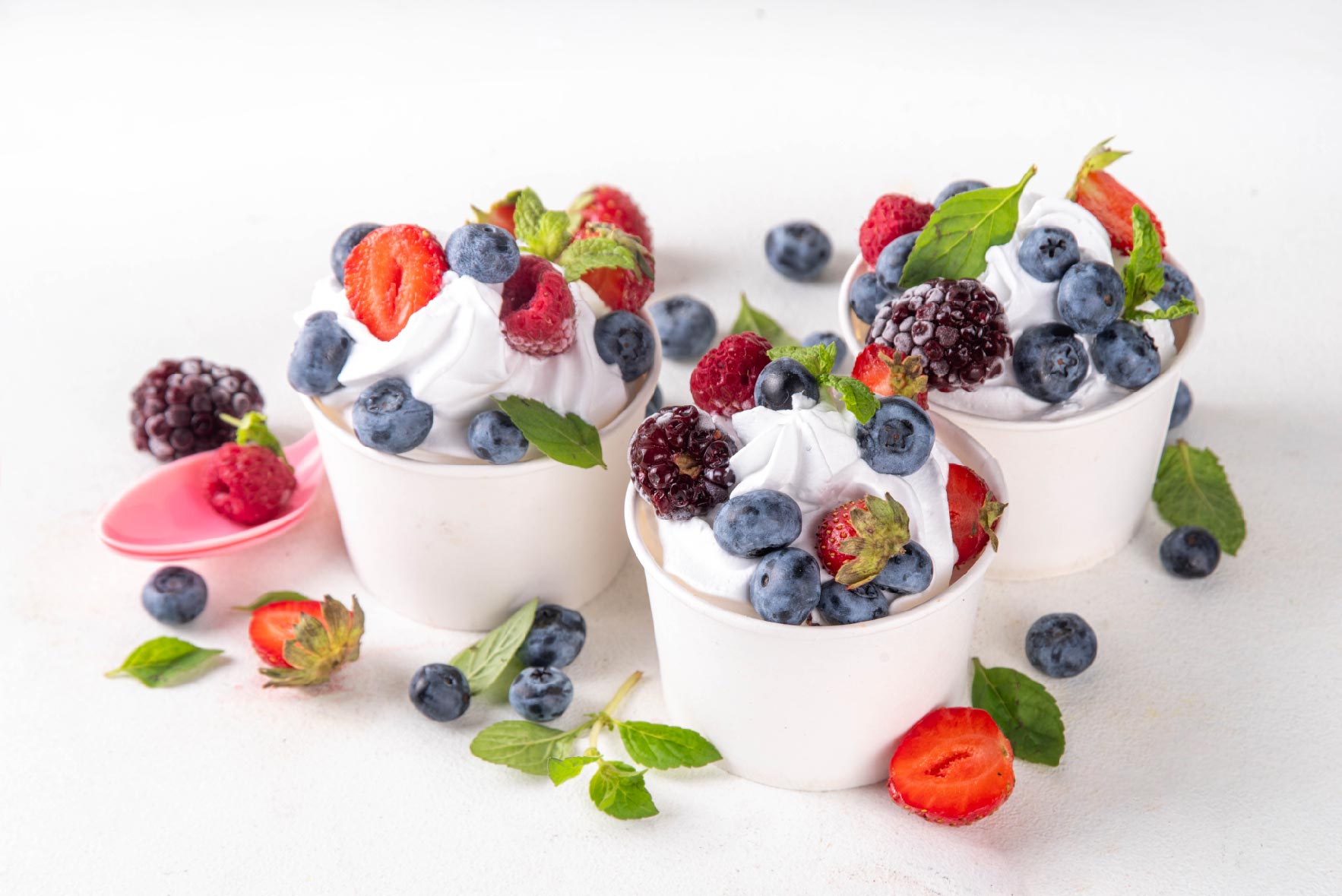 Picture of yoghurt bowls with berries on top