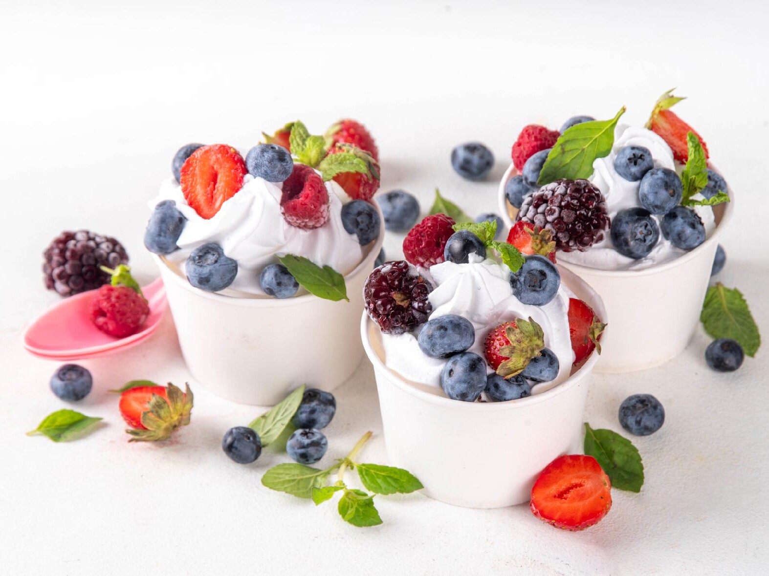 Picture of yoghurt bowls with berries on top